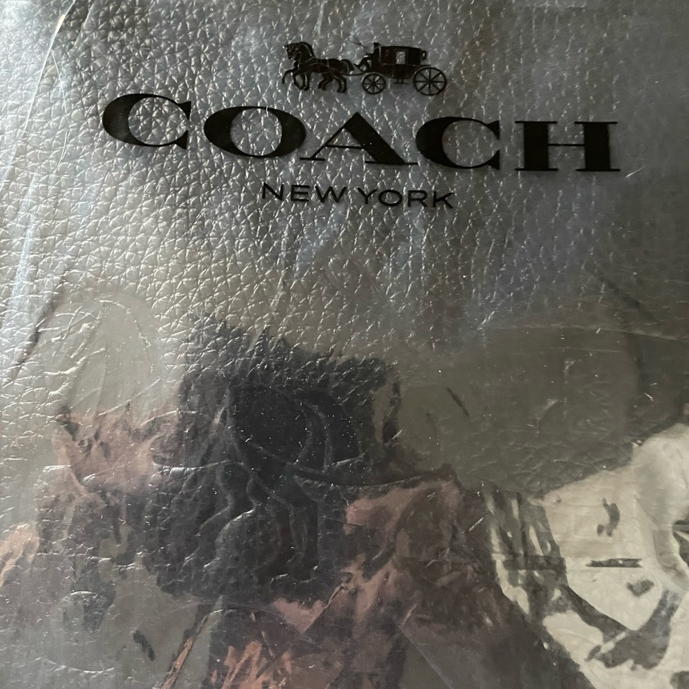 Coach black leather cross body purse with strap. New in bag.